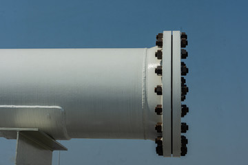The blind flange is installed at the end of the pipe system with a pipe support.