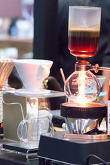 Syphon Coffee or Vacuum Coffee is full immersion tasteful and Barista mix coffee and hot water in vacuum glass chambers by Beam heater.