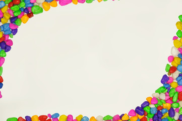 Colored pebbles on a white background