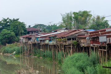 The community of villagers with houses that are wood, thatched roofs that began to rust and planted along the river