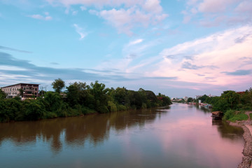Fototapeta na wymiar River view in urban city with beautiful evening sky.