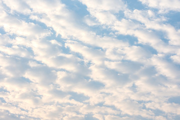 White clouds in the blue sky on a bright day