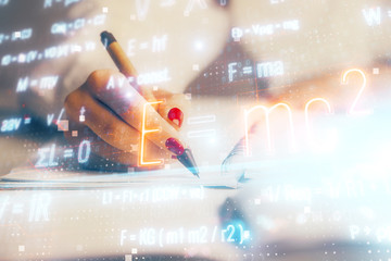 Science formula hologram over woman's hands taking notes background. Concept of study. Multi...
