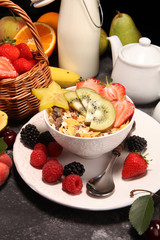 Healthy breakfast. Bowl of yogurt with granola and berries, fresh fruits and smootihies