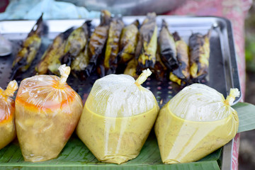 The seller scooped into plastic bags for sale.