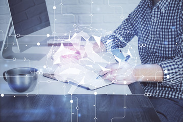 Man typing on keyboard background with brain hologram. Concept of big Data. Double exposure.