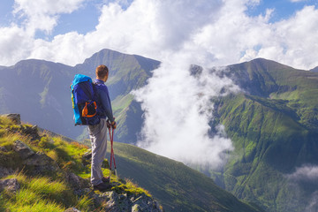 Hiker looks at the beautiful Romanian Carpathians, Fagerash array
