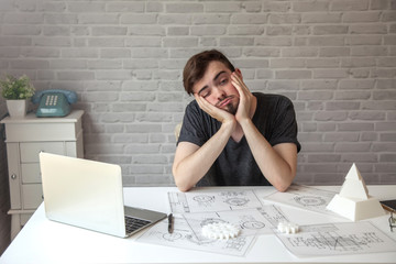 Man designer creative mechanical system cog gear wheels.