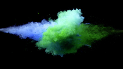 Collision of colored powder isolated on black