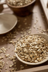 Oat flakes in a bamboo bowl