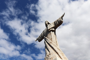 Fototapeta na wymiar Christ the King ( Cristo Rei) Statue in Garajau, Madeira, Portugal
