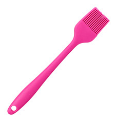 Pink culinary brush, kitchen utensil. Isolated background