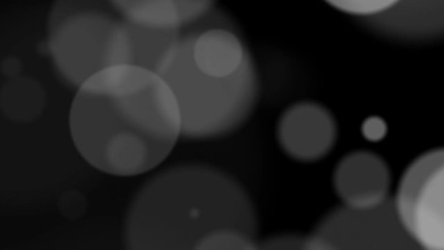 Transparent circles of different diameters in motion on a black background HD 1080p