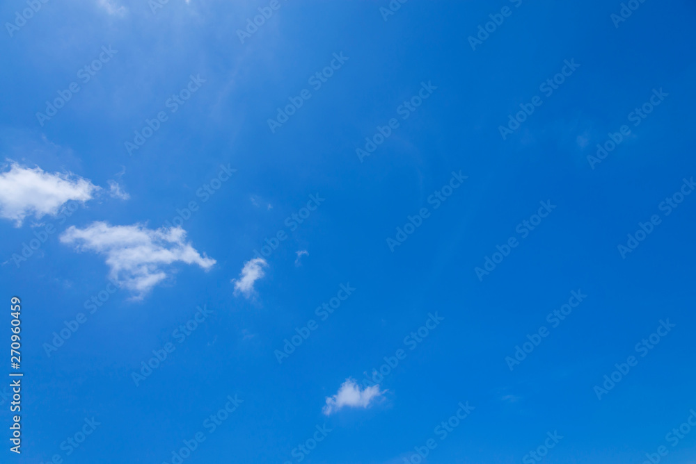 Wall mural blue sky with close up white fluffy tiny clouds background and pattern