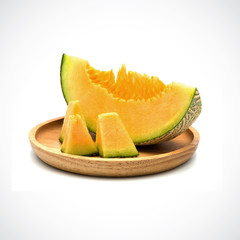 Cantaloupe Melon, In a wooden plate with Orange flesh on the White Blackground.
