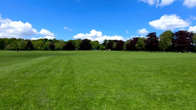 Coventry, West Midlands, UK - May 21, 2019: Panning around a wide area of grass land in the war memorial public park in Coventry