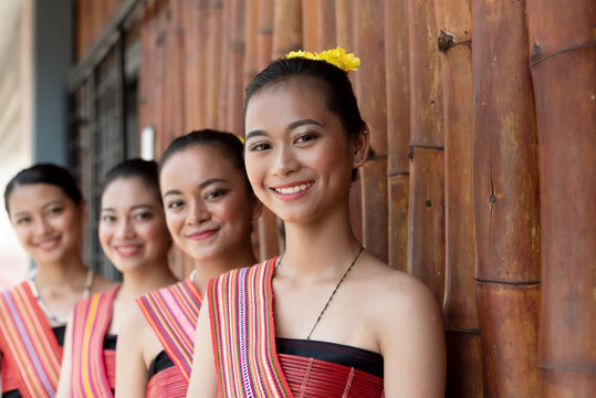 Portraits of Kadazan Dusun young girls in traditional attire from Kota Belud district during state level Harvest Festival in KDCA, Kota Kinabalu, Sabah Malaysia - selective focus.