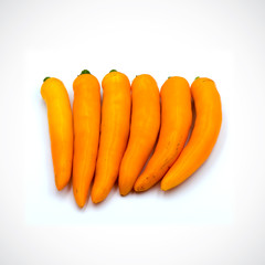 Yellow hot chili pepper isolated on the white background.