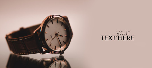 Elegant wrist watch closeup on dark