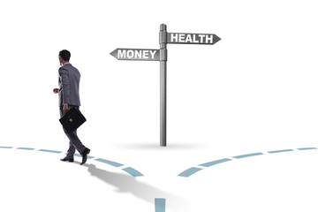 Businessman choosing between money and health