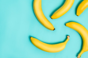Flat lay of bananas on blue background
