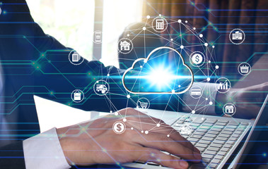 Businessman hand use laptop computer with virtual cloud computing icon over the Network connection, Cyber Security Data Protection Business Technology Privacy concept