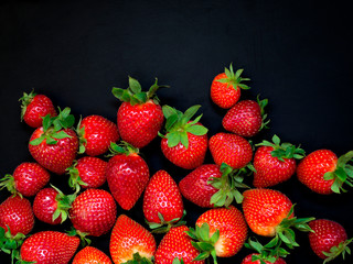 Red strawberry on black background. Background. Isolated on black