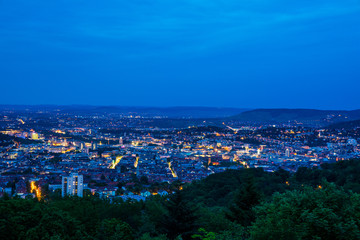 Germany, Stuttgart state capital houses of big city from hilltop of mount rubble in magical twilight mood by night