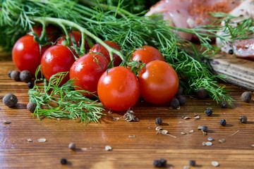 The photo shows a wooden table on which lies a set of vegetables for cooking.