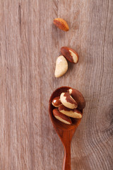 Tasty brasil nuts on wooden background. closeup