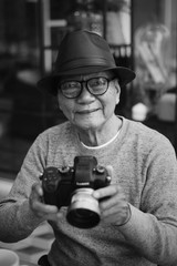 Portrait of Asian Senior Man drinking coffee in cafe
