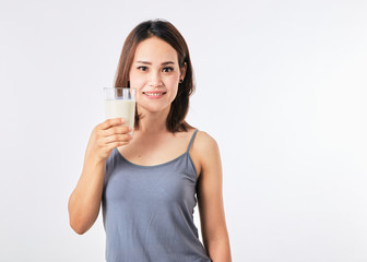 Woman holding a glass of milk