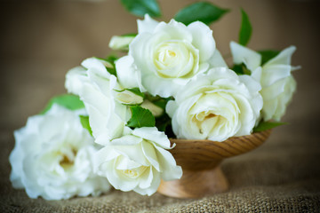 bouquet of beautiful white roses on burlap
