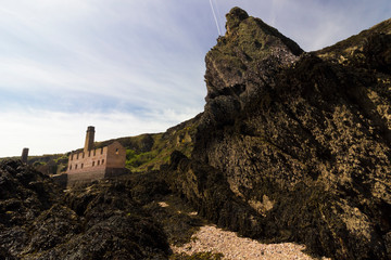 View of the derelict workshop and accommodation area for the former employees of Porth Wen...