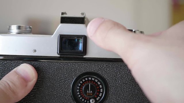 Taking photos in a vintage camera. Rear view