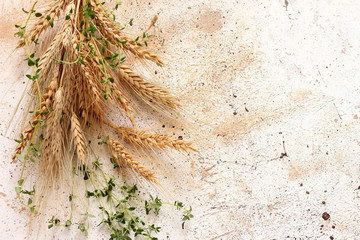 Spikelets of wheat on table