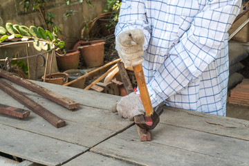 The carpenter was building something by wood.