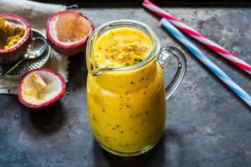 Tropical smoothie with mango and passion fruit