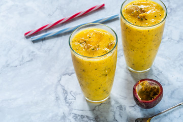 Tropical smoothie with mango and passion fruit
