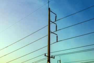 Electricity pole against blue sky clouds in dawn time, Transmission line of electricity to rural,...