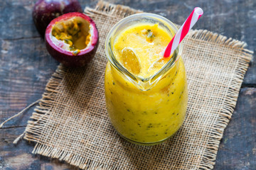 Tropical smoothie with mango and passion fruit