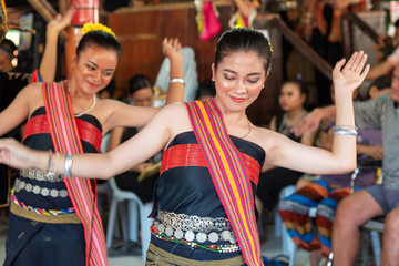 Beautiful young girls from Kota Belud Kadazan Dusun ethnic performed traditional dance during state level Harvest Festival in KDCA, Kota Kinabalu, Sabah Malaysia. - obrazy, fototapety, plakaty
