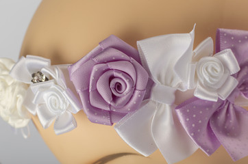 Head of child mannequin with bandage for girls on white background.