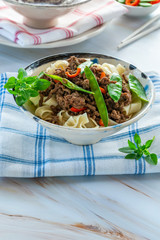 Chinese five-spice beef and sugar snap noodles - high angle view