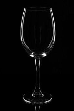 Empty clear wine glass. isolated on black background