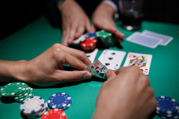 poker player bets all chips. Big poker risks. poker table and hands close-up