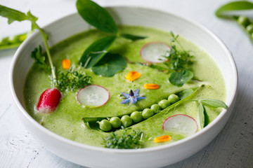 Summer pea soup with fresh vegetables