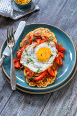 Sweetcorn pancakes with fried egg and chorizo and red pepper salsa - high angle view