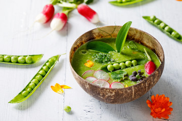 Summer pea soup with fresh vegetables