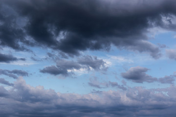 Fototapeta premium Cumulus epic scenic storm clouds in the blue sky background texture